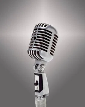 Mikrofone, Das alte Mikrofon über grauem Hintergrund The old microphone ov.. Stock Photos