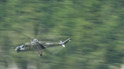 Mil Mi-24 Hind russian gunship and attack helicopter at high speed Stock Footage
