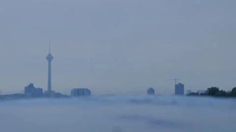 Milad Tower skyline with rain drops falling on blurred water surface Stock Footage 317835664