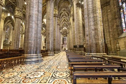 Milan Gothic Gothic Cathedral Interior With Tall Pillars, Stained Glass And.. Foto stock