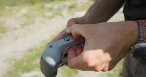 Milan, Italy - 08/01/2024: A man inserts a micro SD memory card into a Stock Footage 282462018