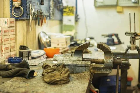  MILAN, ITALY 3 FEBRUARY 2020: Rusty metal vice on the machine shop bench ... Stock Photos