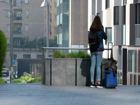Milan, Italy: Lady ready to leave in place Gae Aulenti Stock Footage