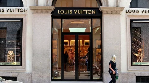 Italy milan louis vuitton store hi-res stock photography and
