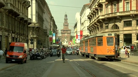 Milan tram at stop and pulls off Stock Footage 75894304