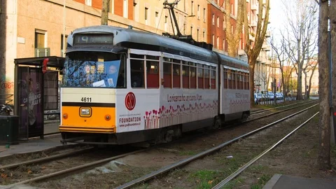 Milan yellow tram passing through Stock-Footage 101383550
