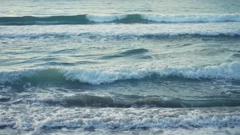 Mild ocean waves coming ashore at dusk in Cilento Video stock 255795270