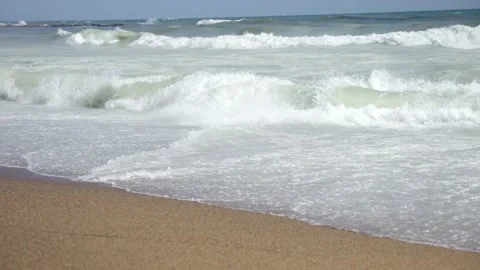 Mild waves on a beach - Slow Motion Stock Footage 173767361