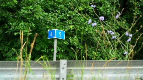 Mileage marker on the road Stock Footage 64771660