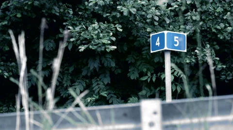 Mileage marker on the road Stock Footage 64771700