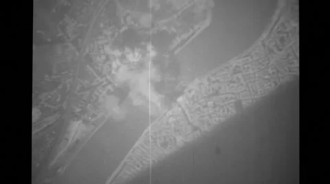 Military Aeroplane dropping bombs to the ground Stock Footage 39908464