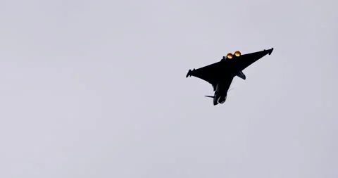 Military aircraft performs combat maneuvers using full power of the afterburner Stock Footage 147343433
