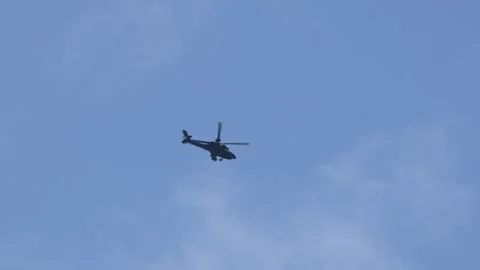 Military Apache attack helicopter blue sky 動画素材 312249024