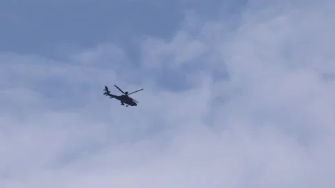 Military Apache attack helicopter blue sky side view 動画素材 312249029