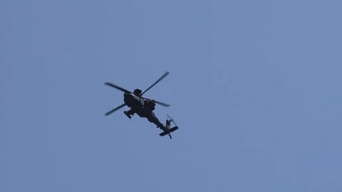 Military Apache attack helicopter flying overhead 動画素材 312249027
