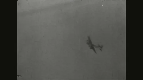 Military bomber goes down, other planes still intact - 1942 Stock Footage 90459765