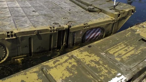 Military bridge with an internal compartment of the pontoon park based on the Stock Footage 117693702