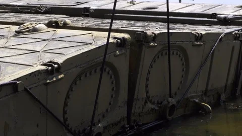 Military bridge with an internal compartment of the pontoon park based on the Stock Footage 117694062
