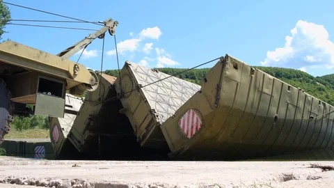 Military bridge with an internal compartment of the pontoon park based on the Stock Footage 123871925