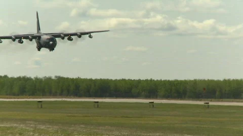 Military, C130 Hercules transport plane landing, follow shot Stock Footage