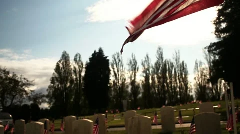 Military Cemetery Rising To Large American Flag Stock Footage