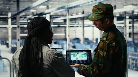 Military commander and female programmer in data center tracking coordinates Stock Footage 314805308