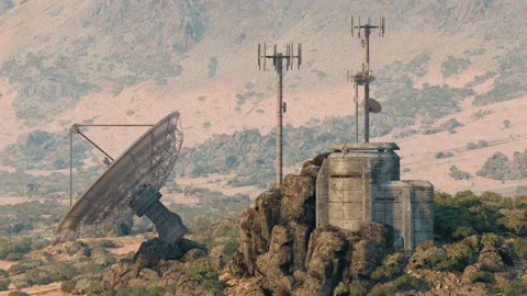 Military communications facility in remote mountain area during daylight hours Stock Footage 327189552