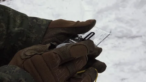 Military compass in hands Stock Footage 266142795