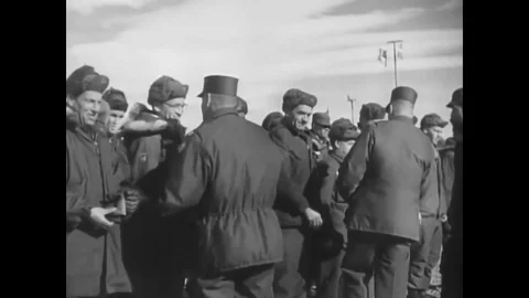Military crewmen are flown away from Camp TUTO, leaving the snow and ice of Stock Footage