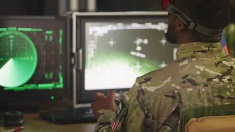 Military drone operator practicing aerial surveillance using digital simulator Stock Footage 335538974