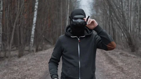 Military drone operator at war, preparing for flight, filming in forest Stock Footage 305322254