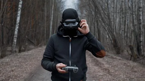 Military drone operator at war, preparing for flight, filming in forest Stock Photos
