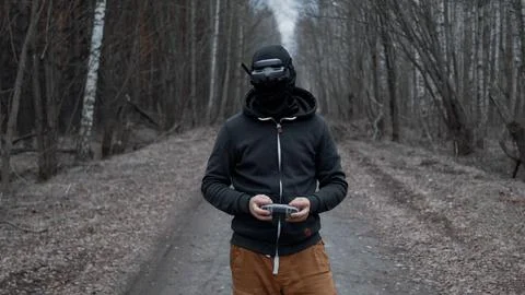 Military drone operator at war, preparing for flight, filming in forest Stock Photos