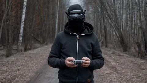 Military drone operator at war, preparing for flight, filming in forest Stock Photos