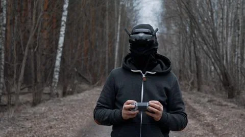 Military drone operator at war, preparing for flight, filming in forest Stock Photos