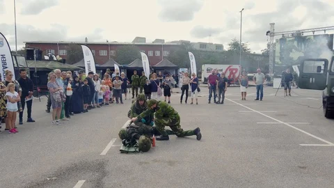 Military educate basic life support, helping person with first aid, crowd Stock Footage 116198079