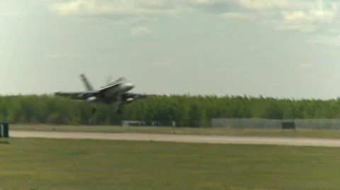 Military, F18 Hornet fighter jet landing follow shot out of frame Stock Footage