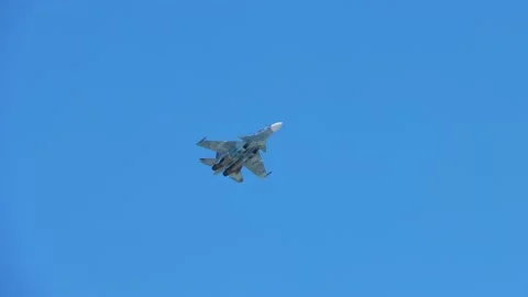 Military fighter jet performs maneuvers in the sky Stock Footage 146489155