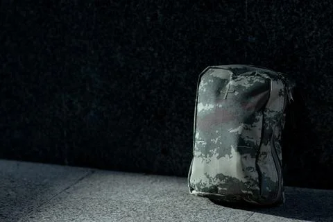 Military first aid kit closeup on marble background with space for text Stock Photos