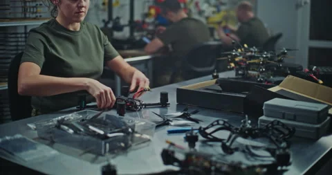 Military Grade Drone Assembly By Focused Female Defense Worker Stock Footage 322111841