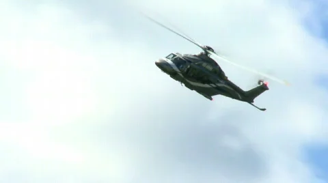 Military helicopter flying on the sky Stock Footage