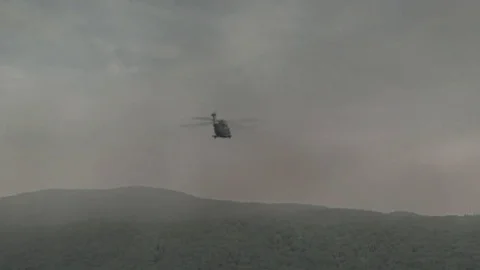 Military Helicopter Flying Through Clouds Stock Footage 78534454