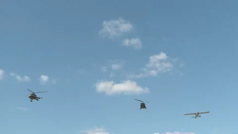 Military helicopter flyover the base Stock Footage 171818302