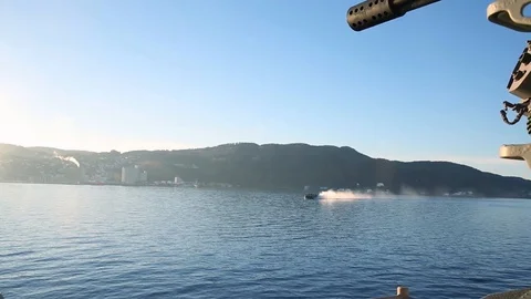 Military hovercraft seen navigating in the ocean from a ship Stock Footage 114018955