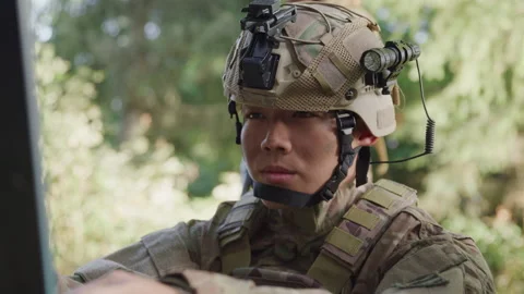 Military Man in a Combat Helmet Checking Information on a Computer 스톡 동영상 208791344