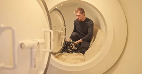 Military man in hyperbaric chamber using BIBS mask Stock Footage 275341648