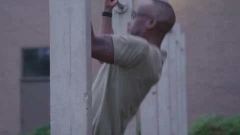 Military Man Outside on Base Doing Pull Ups Stock Footage 208782910