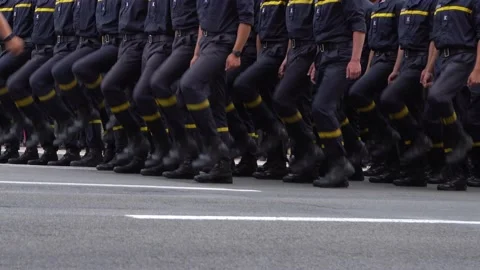 Military marching in the parade. Pixel uniform. Soldiers legs. War background Video stock 238436010