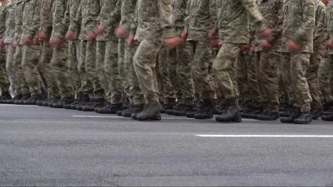 Military marching in the parade. Pixel uniform. Soldiers legs. War background Video stock 238670255