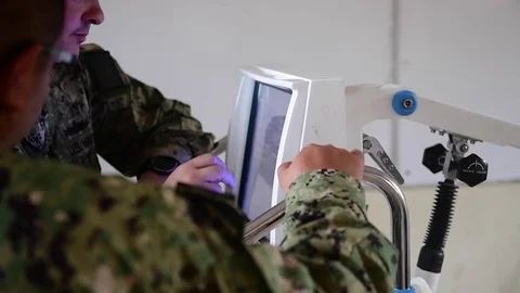 Military medics use touchscreen computer Video stock 97634839